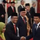 Image Credit Antara - Presiden Joko Widodo (kanan) berjabat tangan dengan Menkumham Supratman Andi Agtas (ketiga kiri) usai pelantikan di Istana Negara, Jakarta, Senin 19 Agustus 2024.