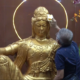 Imaege Credit Istimewa - Umat membersihkan patung Budha di Wihara Arama Mahabuddha.